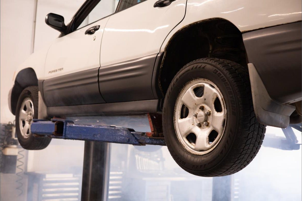 Car up on the lift in the workshop